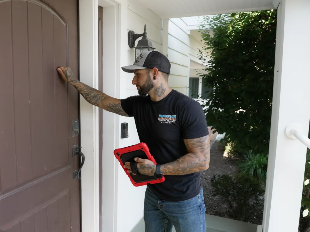 A Kintech technician arriving at a customer's front door