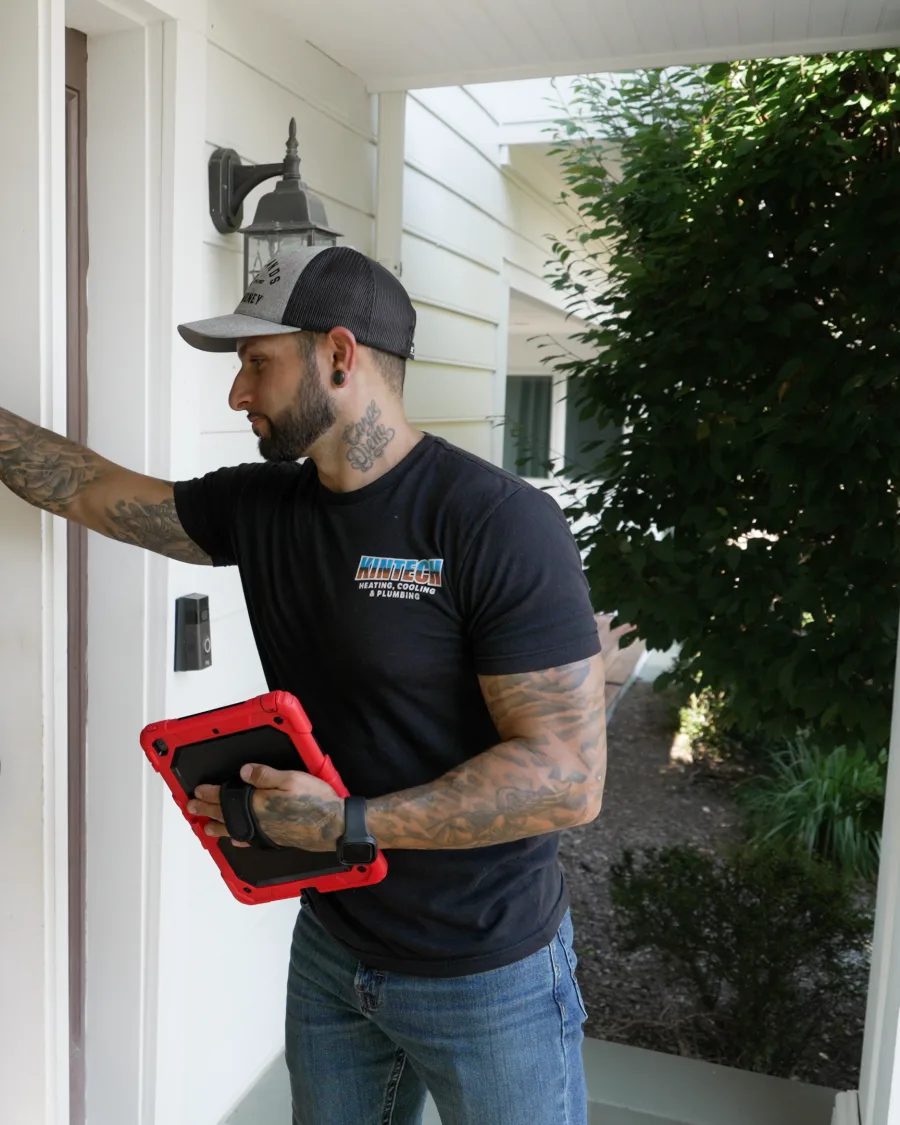 A Kintech technician arriving at a customer's front door